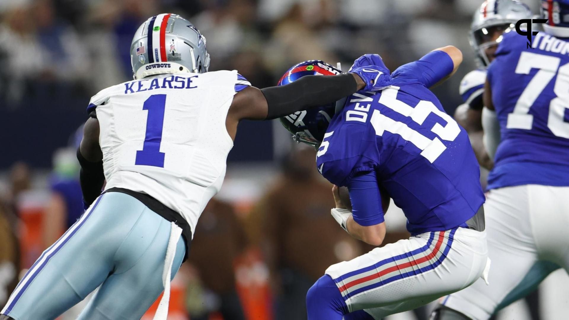 New York Giants quarterback Tommy DeVito (15) avoids the sack by Dallas Cowboys safety Jayron Kearse (1).