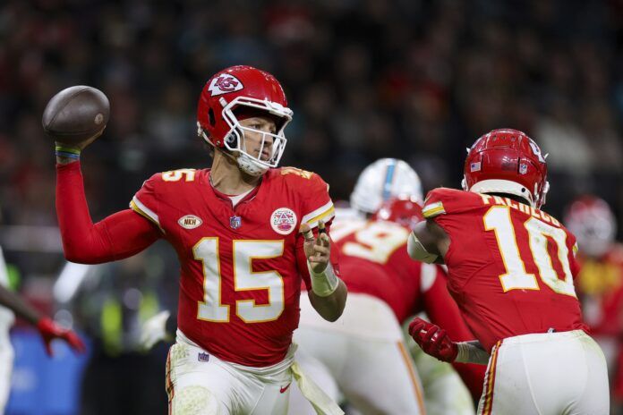 Kansas City Chiefs quarterback Patrick Mahomes (15) drops back to pass against the Miami Dolphins in the fourth quarter during an NFL International Series game at Deutsche Bank Park.