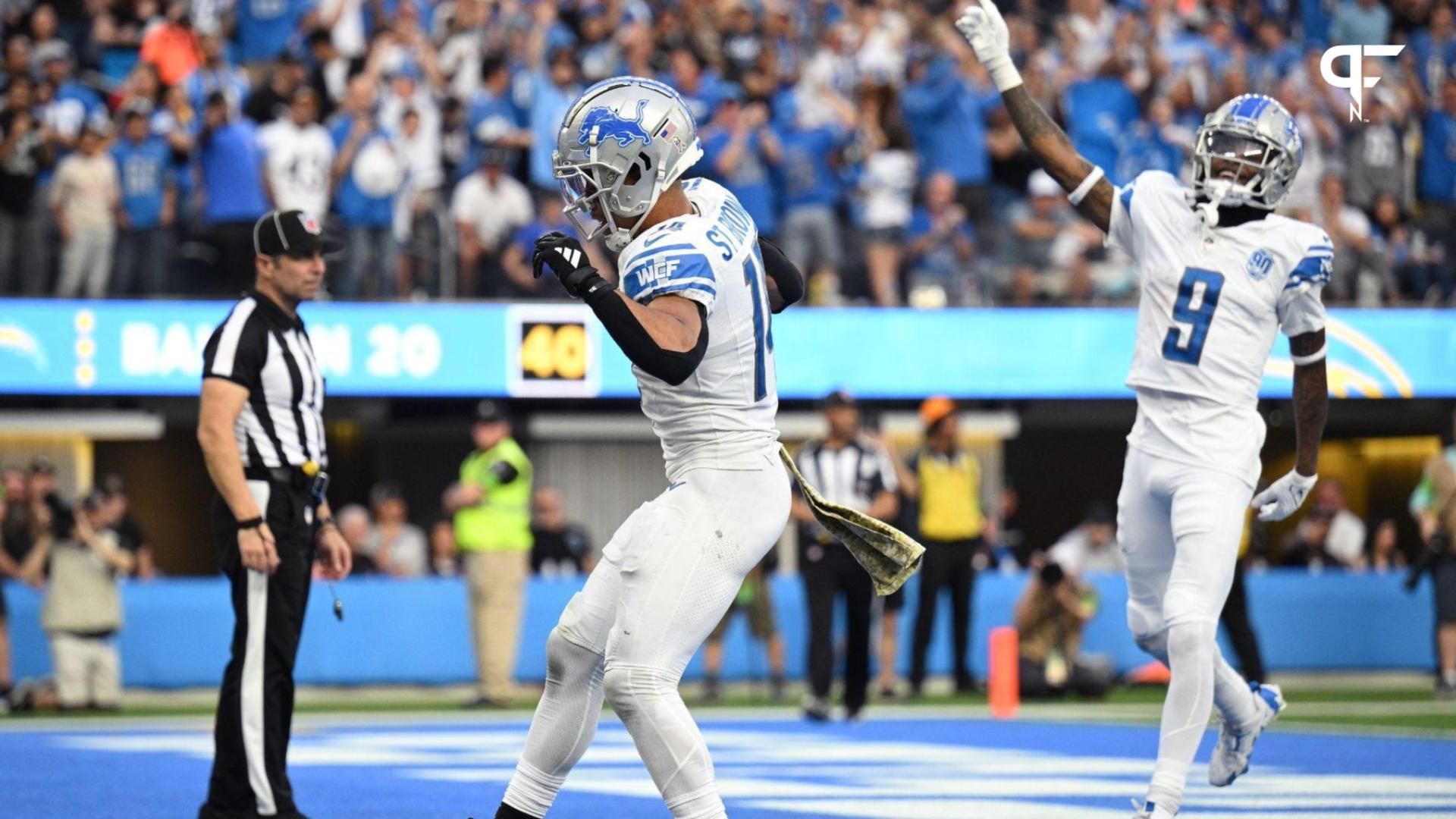 Detroit Lions wide receiver Amon-Ra St. Brown (14) celebrates after scoring a touchdown against the Los Angeles Chargers during the second half at SoFi Stadium.