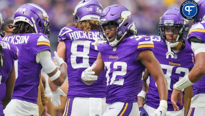 Ty Chandler (32) celebrates his touchdown against the New Orleans Saints in the second quarter at U.S. Bank Stadium.