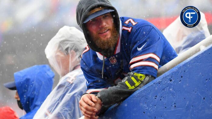 A Buffalo Bills fan looks on during a heavy rain storm prior to the game against the Houston Texans at Highmark Stadium.