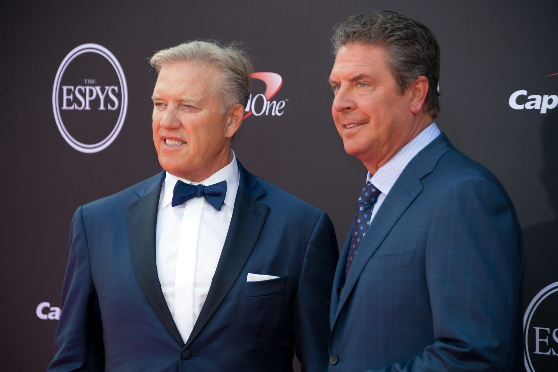 Hall of Fame quarterbacks John Elway and Dan Marino pose for pictures at the ESPYs.