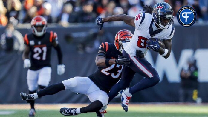 Houston Texans WR Noah Brown (85) tries to break free from a tackle against the Cincinnati Bengals.