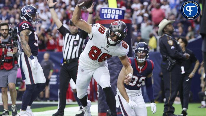 Cade Otton (88) spikes the ball after scoring a touchdown during the fourth quarter against the Houston Texans at NRG Stadium.