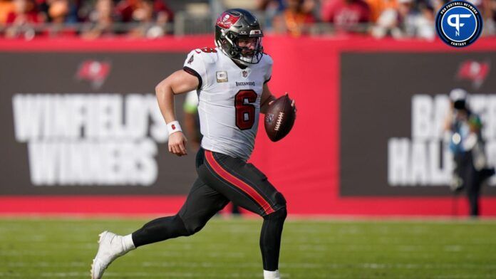 Baker Mayfield (6) runs the ball for a first down against the Tennessee Titans during the fourth quarter at Raymond James Stadium.