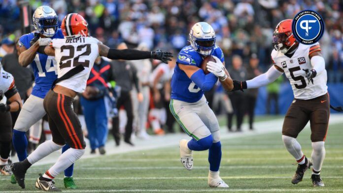 Seattle Seahawks tight end Noah Fant (87) carries the ball after a catch while wide receiver DK Metcalf (14) blocks Cleveland Browns safety Grant Delpit (22) during the second half at Lumen Field.