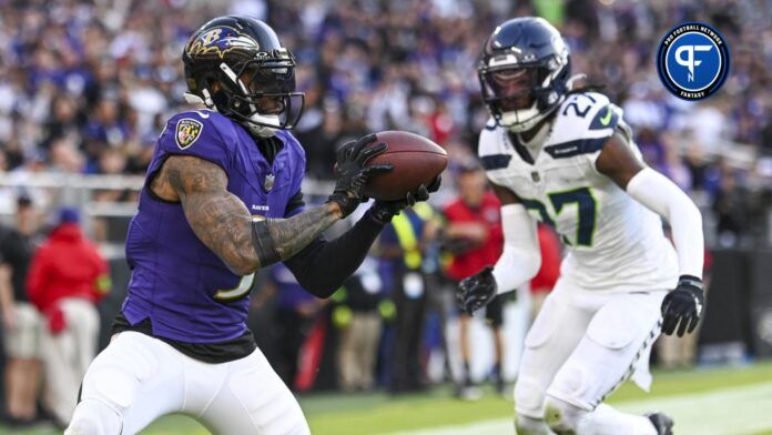 Baltimore Ravens wide receiver Odell Beckham Jr. (3) catches a pass for a touchdown in front of Seattle Seahawks cornerback Riq Woolen (27) during the fourth quarter at M&T Bank Stadium.