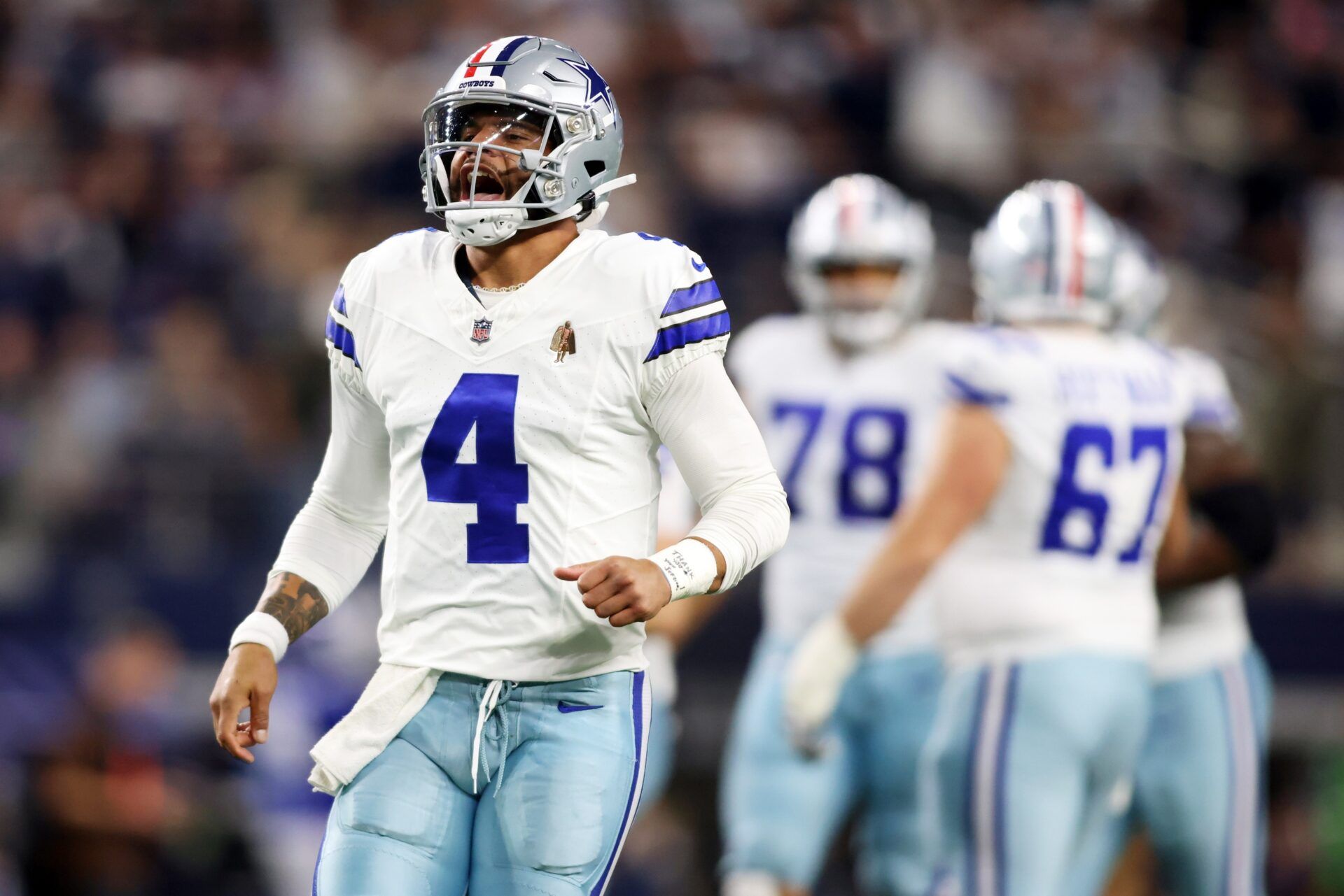 Dallas Cowboys QB Dak Prescott (4) celebrates after a touchdown.