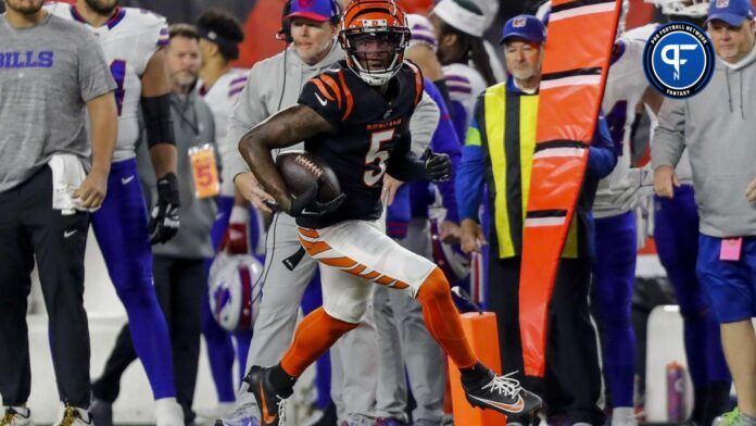 Cincinnati Bengals wide receiver Tee Higgins (5) runs with the ball against the Buffalo Bills in the first half at Paycor Stadium.