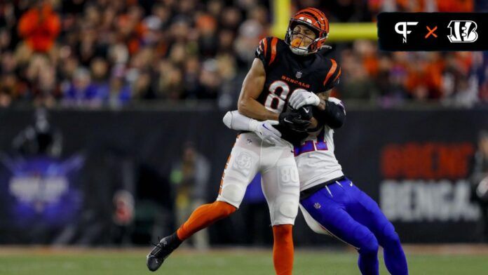 Andrei Iosivas (80) catches a pass against Buffalo Bills safety Jordan Poyer (21) in the first half at Paycor Stadium.