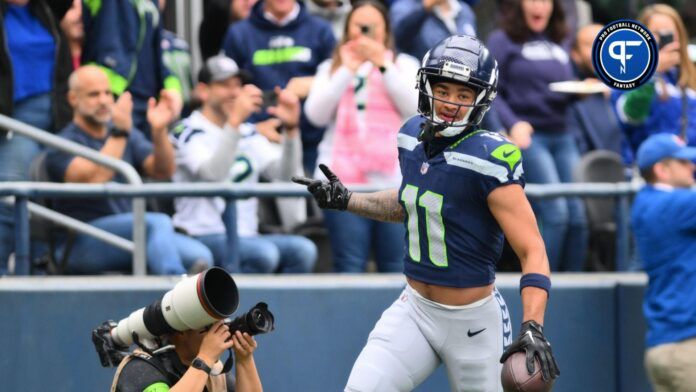 Seattle Seahawks WR Jaxon Smith-Njigba (11) celebrates after scoring a touchdown against the Arizona Cardinals.