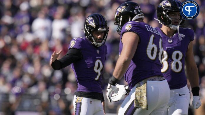 Justin Tucker (9) celebrates his field goal against the Cleveland Browns with guard Ben Cleveland (66) during the first half at M&T Bank Stadium.