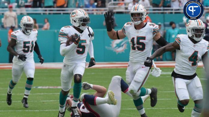 Jalen Ramsey (5) intercepts a pass against the New England Patriots during the first half of an NFL game at Hard Rock Stadium.