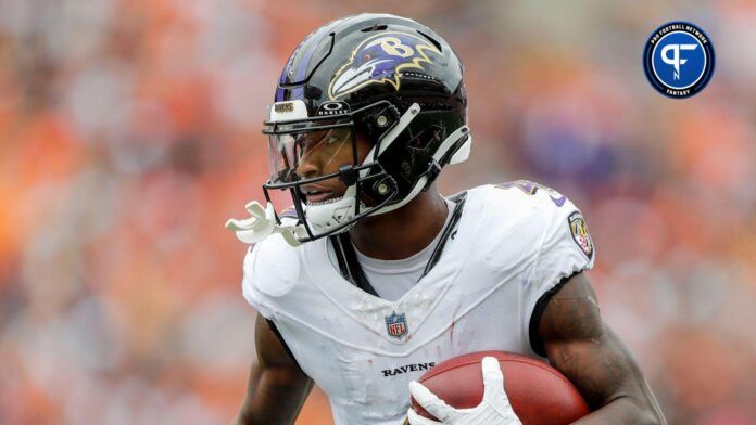 Baltimore Ravens wide receiver Zay Flowers (4) runs with the ball against the Cincinnati Bengals in the second half at Paycor Stadium.