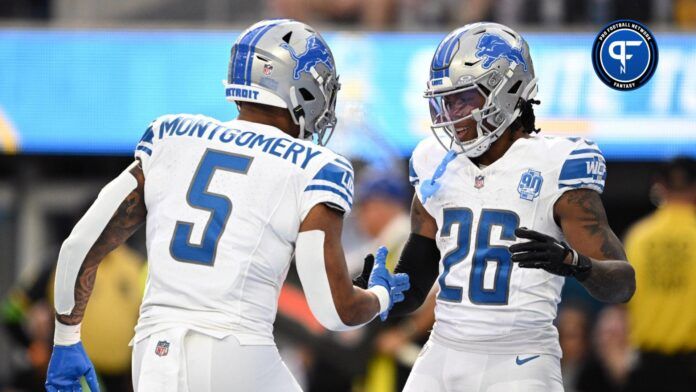 Detroit Lions running back Jahmyr Gibbs (26) celebrates with running back David Montgomery (5) after scoring a touchdown against the Los Angeles Chargers during the first half at SoFi Stadium.