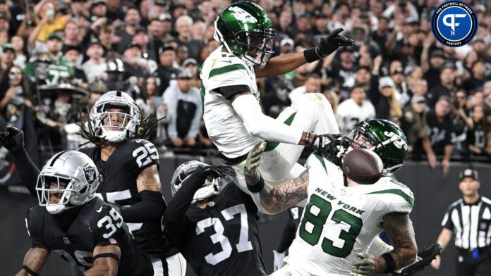 New York Jets wide receiver Garrett Wilson (17) and tight end Tyler Conklin (83) miss a pass in the end zone while defended by Las Vegas Raiders cornerback Nate Hobbs (39), cornerback Tyler Hall (37) and safety Tre'von Moehrig (25) in the fourth quarter at Allegiant Stadium.