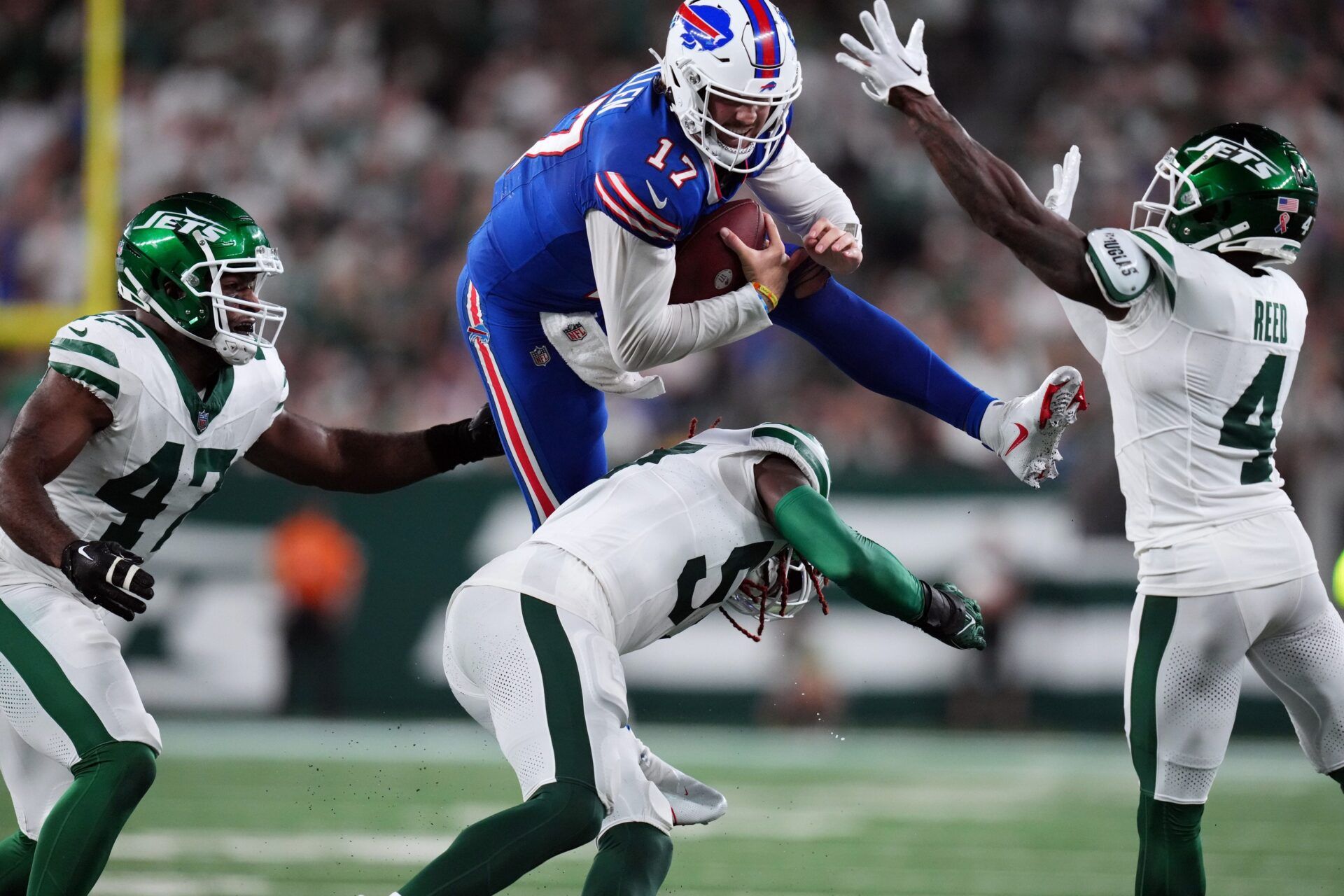 Buffalo Bills QB Josh Allen (17) attempts to hurdle against the New York Jets.