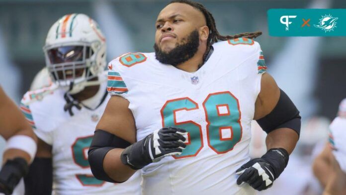 Miami Dolphins OT Robert Hunt (68) runs on the field prior to the game against the New England Patriots.