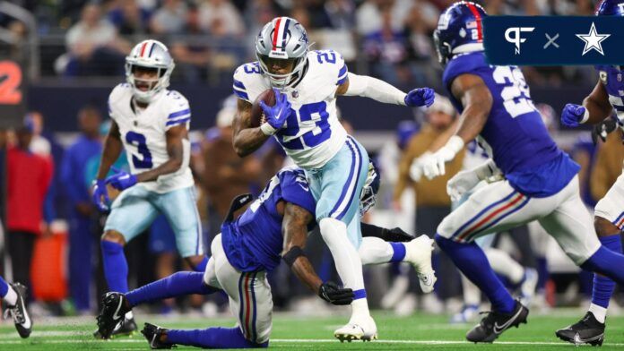 Dallas Cowboys running back Rico Dowdle (23) runs with the ball during the first half against the New York Giants at AT&T Stadium.