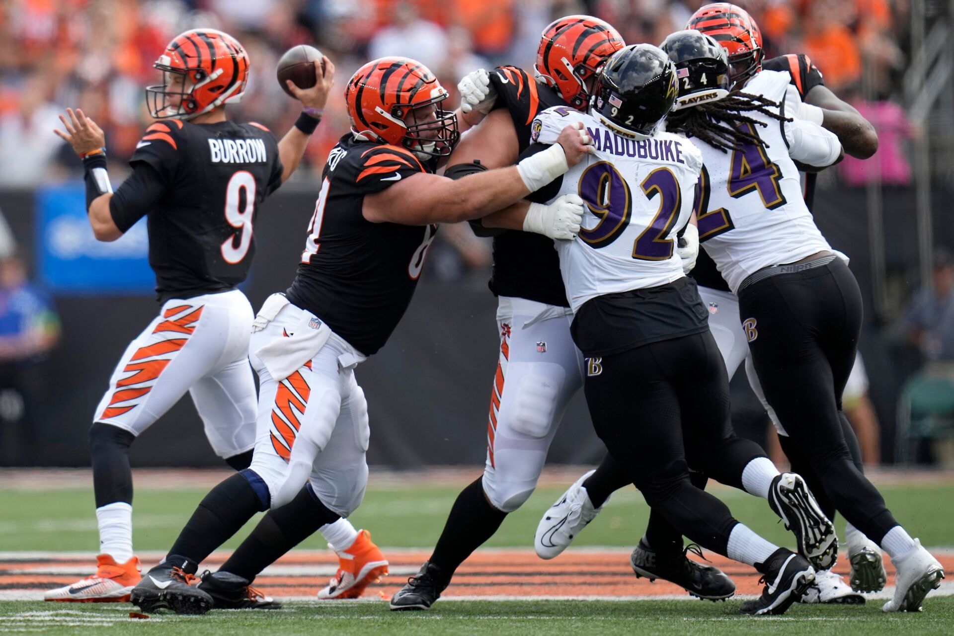 Cincinnati Bengals center Ted Karras (64), Cincinnati Bengals guard Alex Cappa (65) and Cincinnati Bengals offensive tackle Orlando Brown Jr. (75) block as Cincinnati Bengals quarterback Joe Burrow (9) throws in the second quarter of a Week 2 NFL football game between the Baltimore Ravens and the Cincinnati Bengals Sunday, Sept. 17, 2023, at Paycor Stadium in Cincinnati.