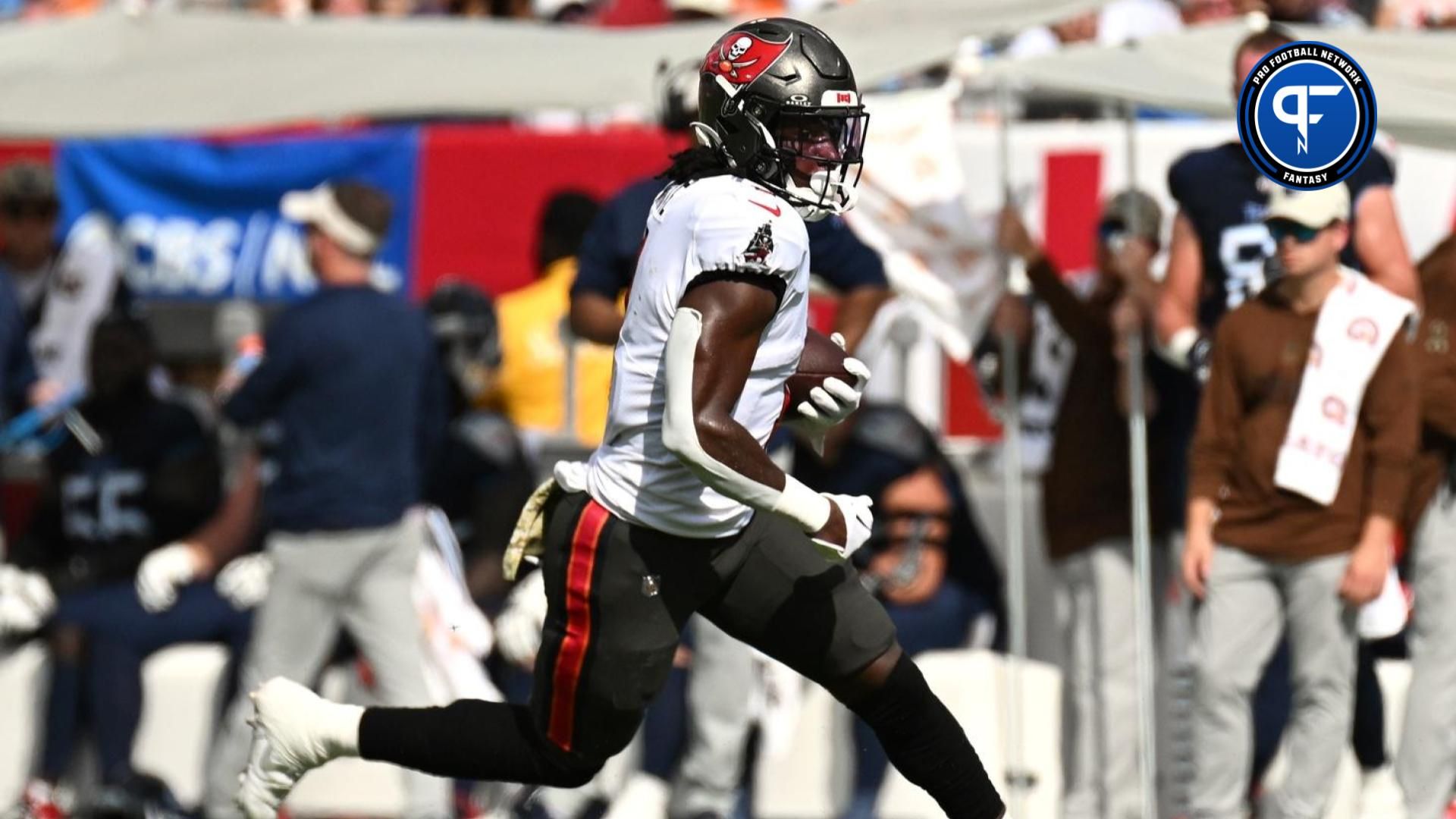 Rachaad White (1) scores a touchdown in the first half against the Tennessee Titans at Raymond James Stadium.