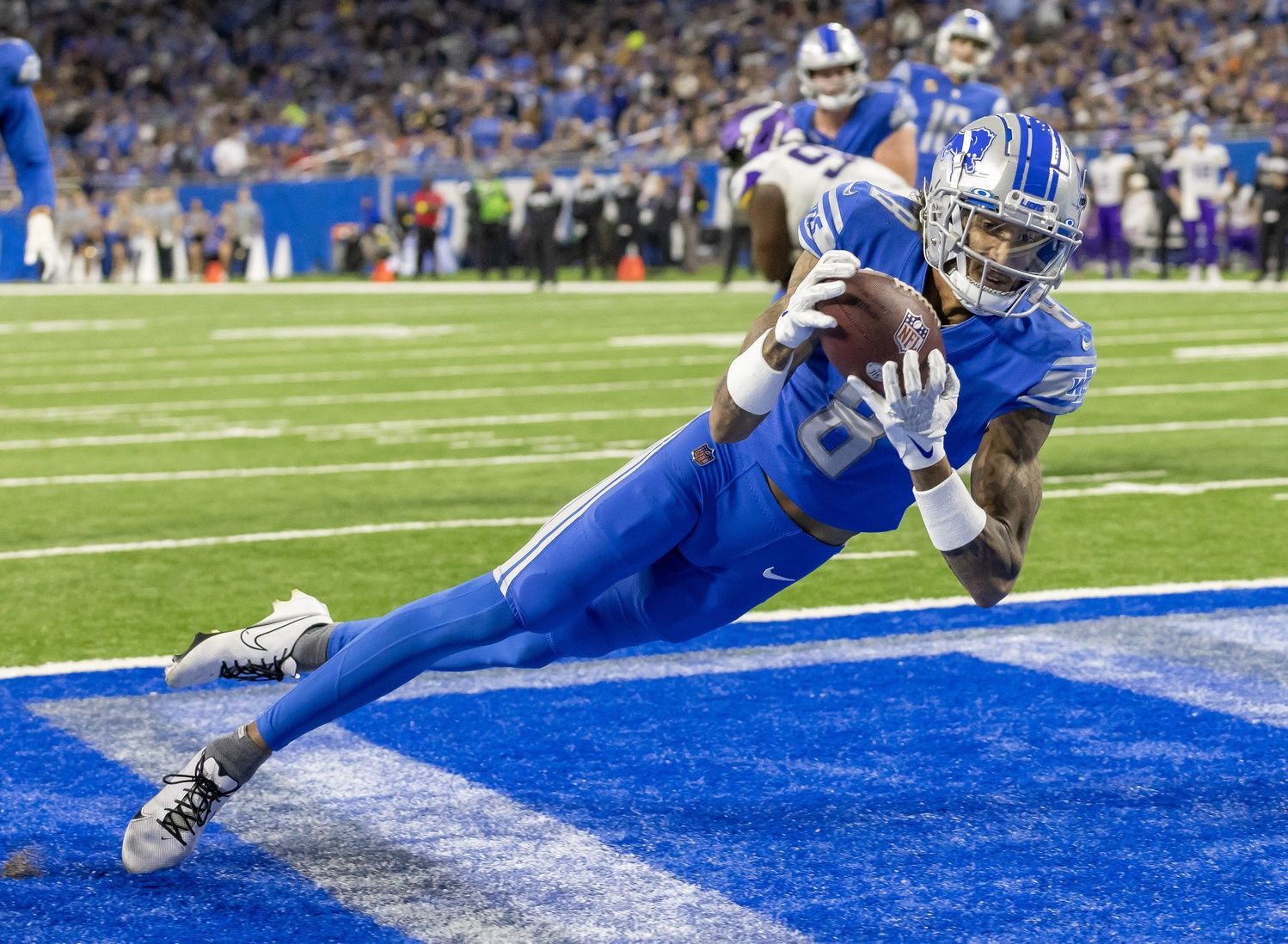 Josh Reynolds (8) catches the ball for a touchdown against the Minnesota Vikings during the second half at Ford Field.