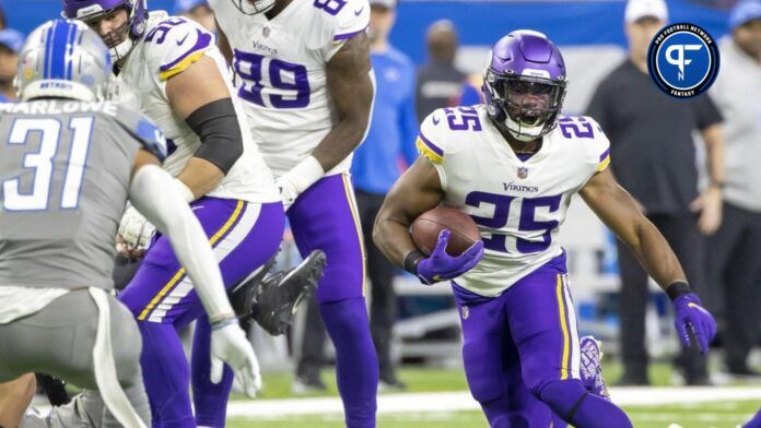 Minnesota Vikings running back Alexander Mattison (25) runs with the ball in the first half against the Detroit Lions at Ford Field.