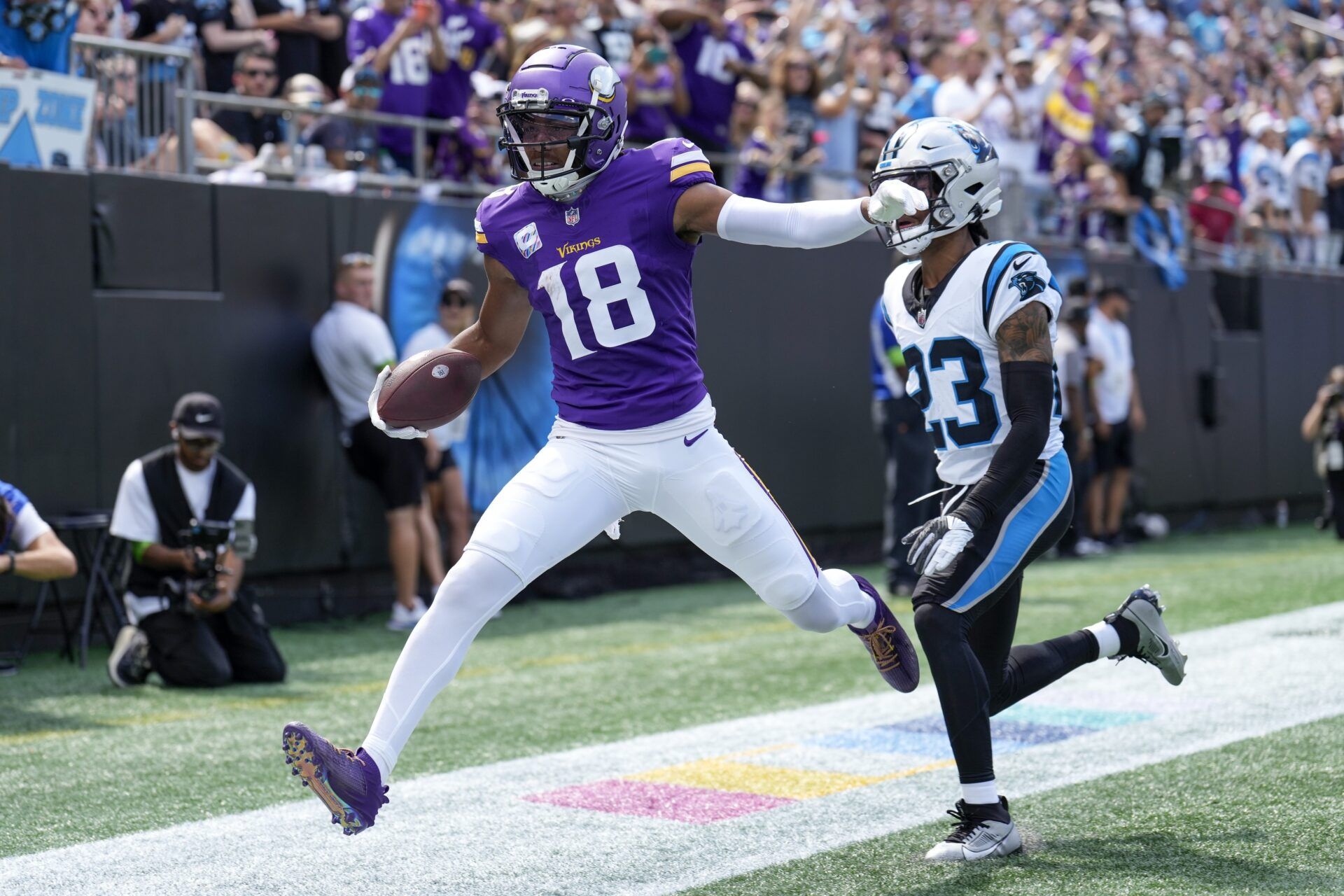 Minnesota Vikings wide receiver Justin Jefferson (18) in the end zone past Carolina Panthers cornerback CJ Henderson (23) during the first quarter at Bank of America Stadium.