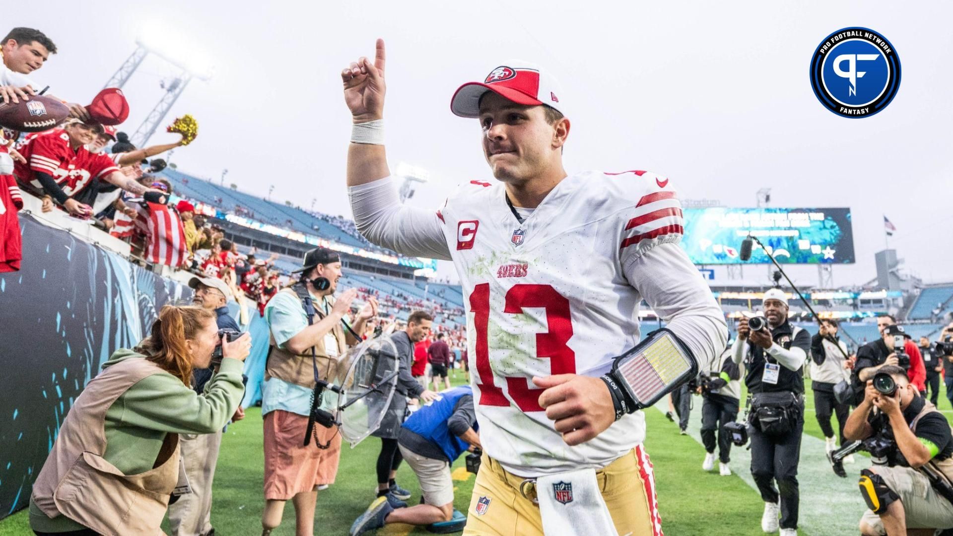 San Fransisco 49ers quarterback Brock Purdy (13) celebrates the win over the Jacksonville Jaguars after the game at EverBank Stadium.