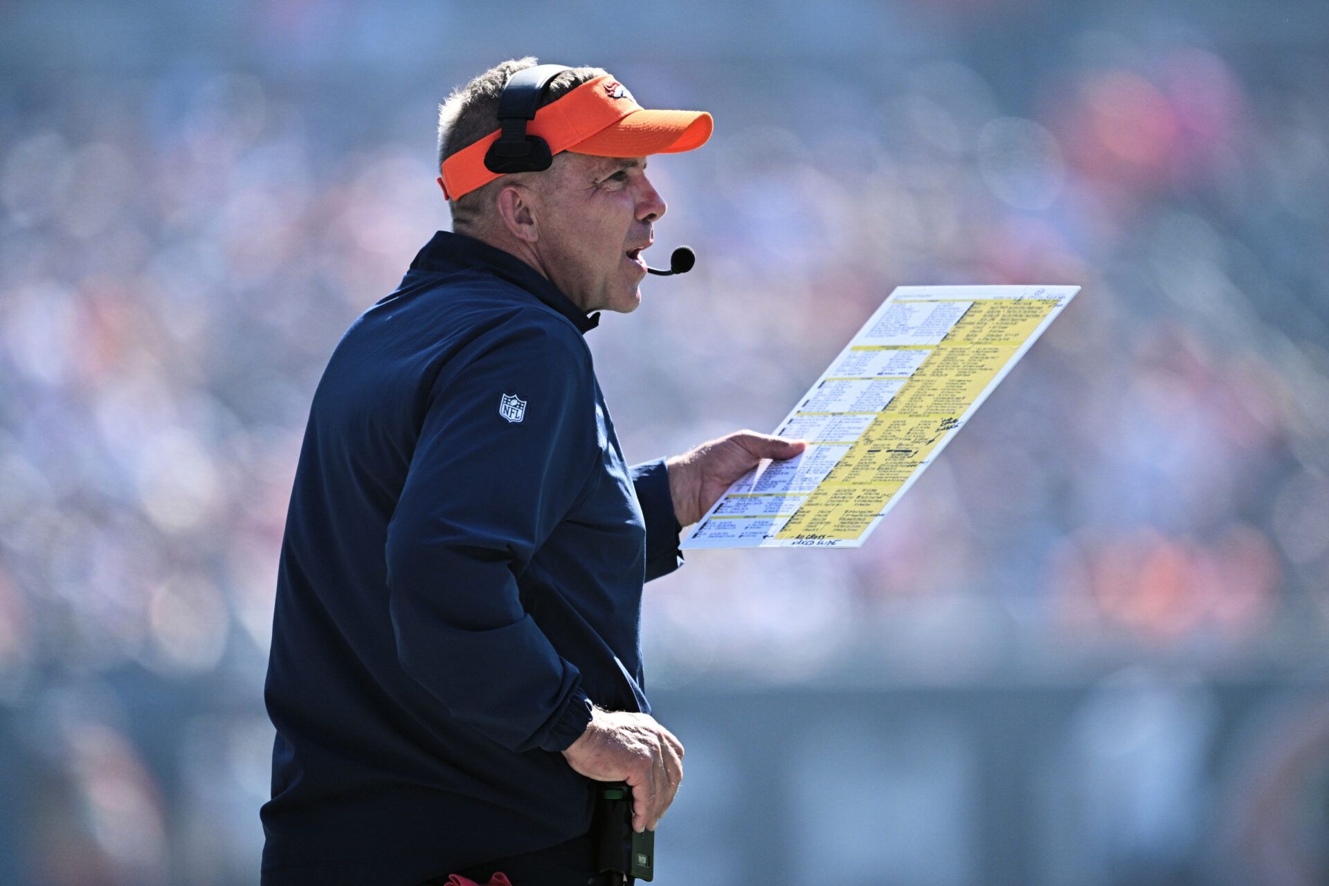 Denver Broncos head coach Sean Payton watches his team play against the Chicago Bears in the fourth quarter at Soldier Field.