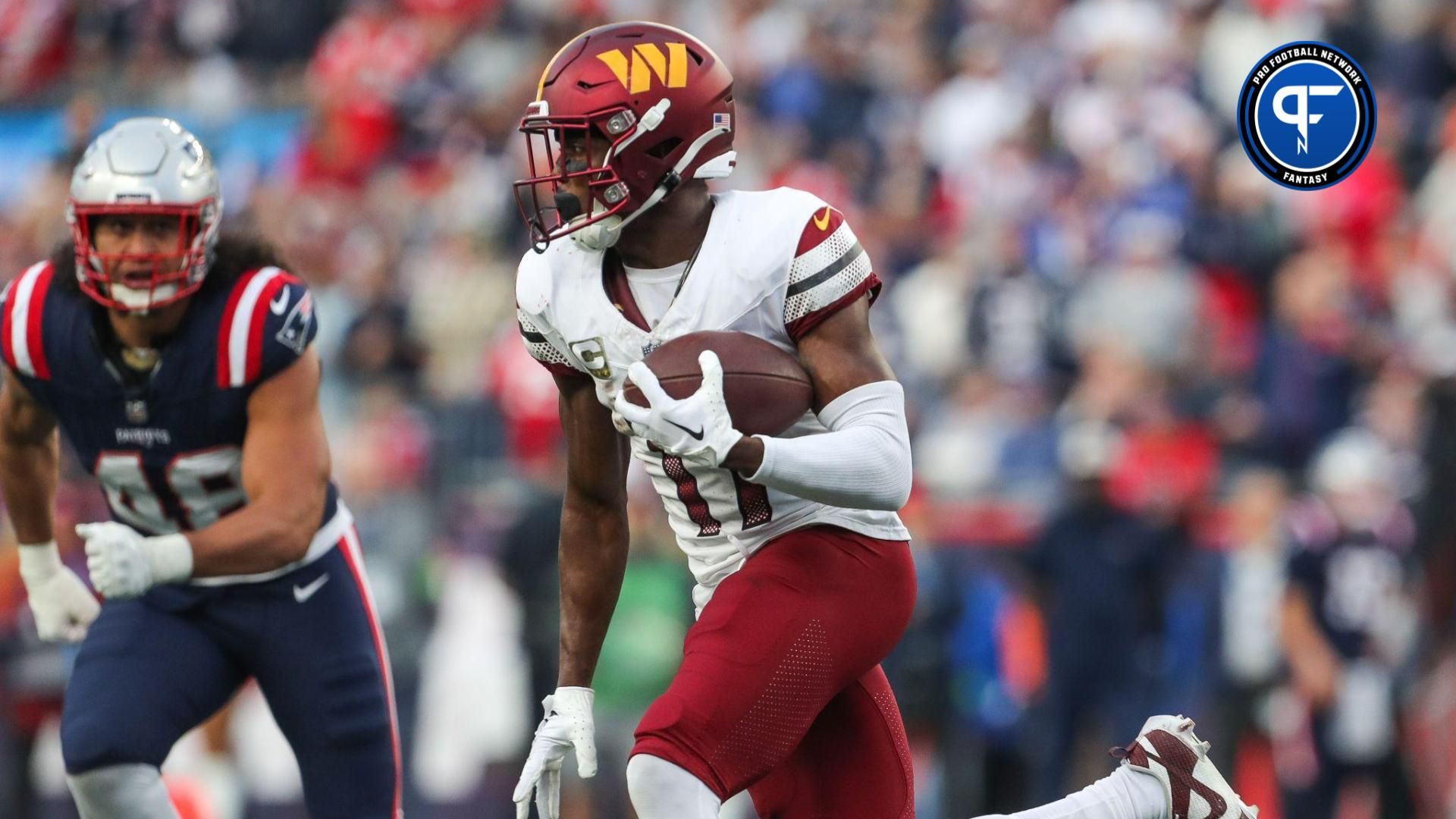 Washington Commanders receiver Terry McLaurin (17) runs the ball during the second half against the New England Patriots at Gillette Stadium.