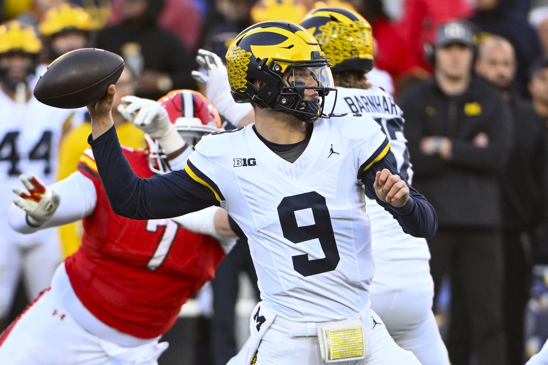 J.J. McCarthy (9) attempts a pass against the Maryland Terrapins during the second half at SECU Stadium.