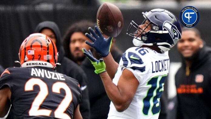 Seattle Seahawks wide receiver Tyler Lockett (16) catches a pass along the sideline as Cincinnati Bengals cornerback Chidobe Awuzie (22) defends in the second quarter during an NFL football game between the Seattle Seahawks and the Cincinnati Bengals Sunday, Oct. 15, 2023, at Paycor Stadium in Cincinnati.