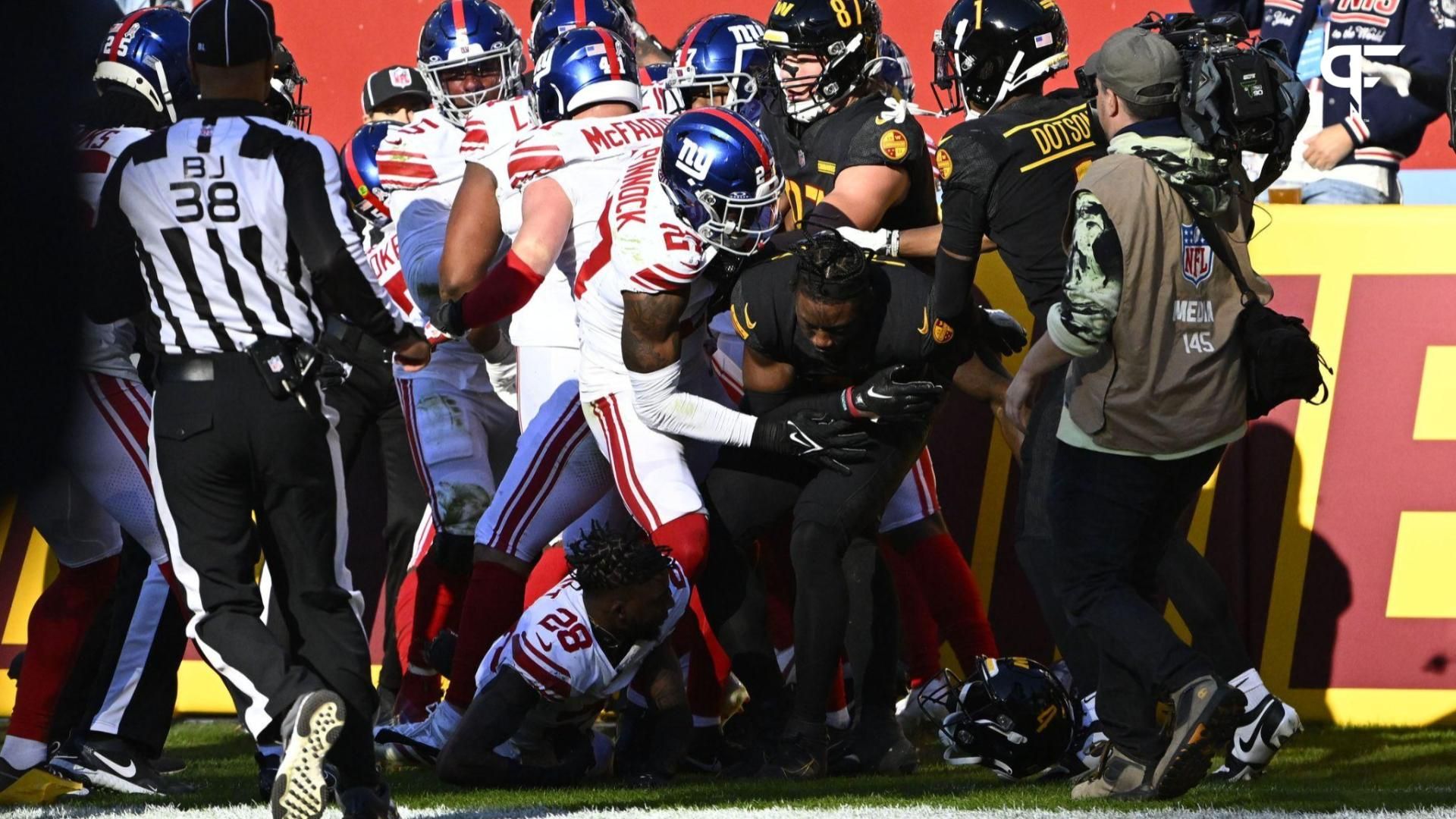 New York Giants safety Jason Pinnock (27) gets in a altercation with Washington Commanders wide receiver Curtis Samuel (4) during the first half at FedExField.