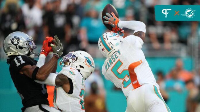 Miami Dolphins cornerback Jalen Ramsey (5) intercepts the a pass intended for Las Vegas Raiders wide receiver Tre Tucker (11) during the second half at Hard Rock Stadium.