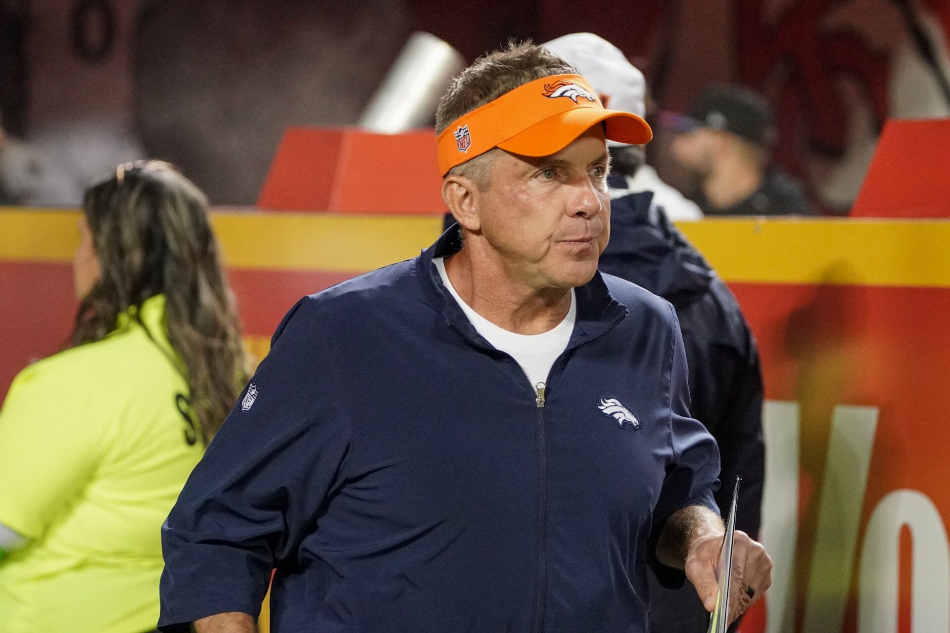 Denver Broncos head coach Sean Payton runs onto the field against the Kansas City Chiefs prior to a game at GEHA Field at Arrowhead Stadium.