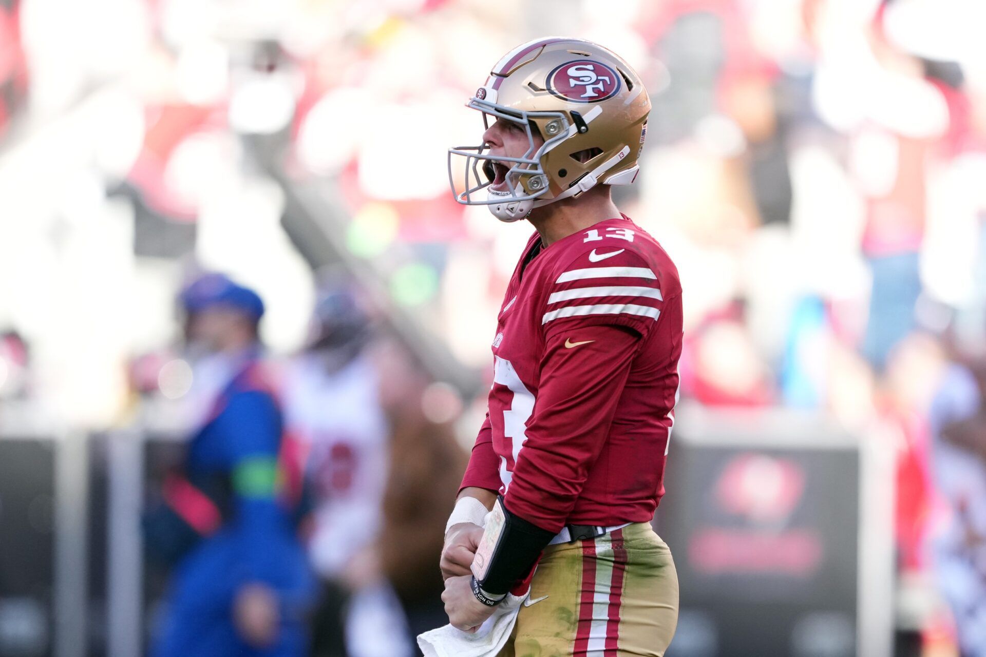 Brock Purdy (13) reacts after throwing a touchdown pass during the third quarter against the Tampa Bay Buccaneers at Levi's Stadium.