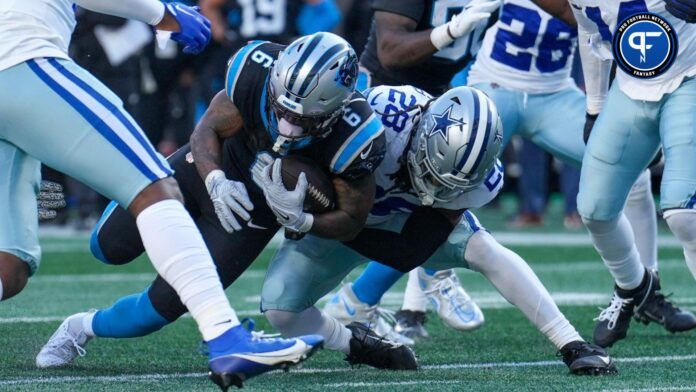 Carolina Panthers running back Miles Sanders (6) is tackled near the goal line by Dallas Cowboys safety Malik Hooker (28) during the second half at Bank of America Stadium.