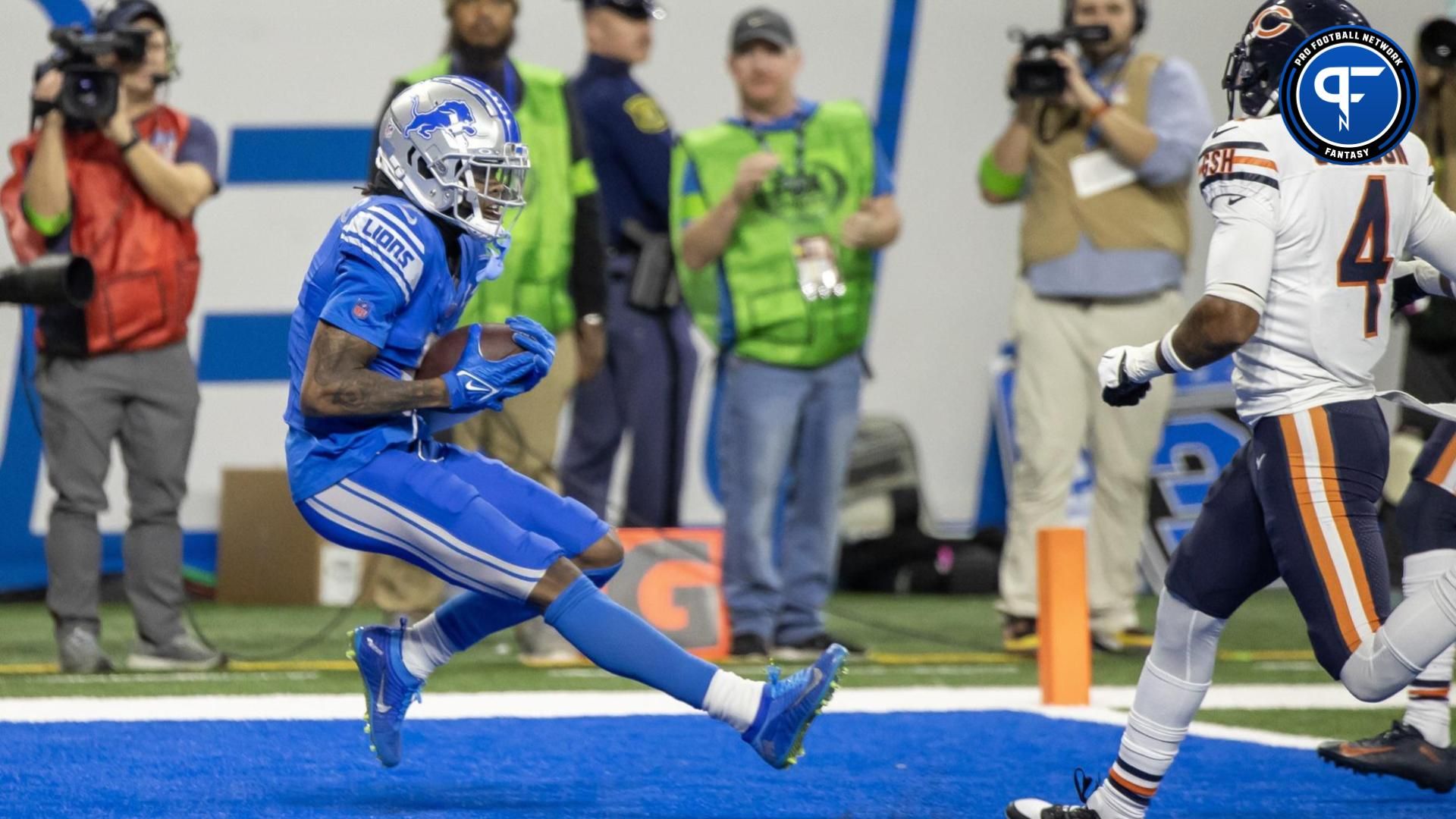 Detroit Lions wide receiver Jameson Williams (9) catches a pass for a touchdown in front of Chicago Bears safety Eddie Jackson (4) during the second half at Ford Field.