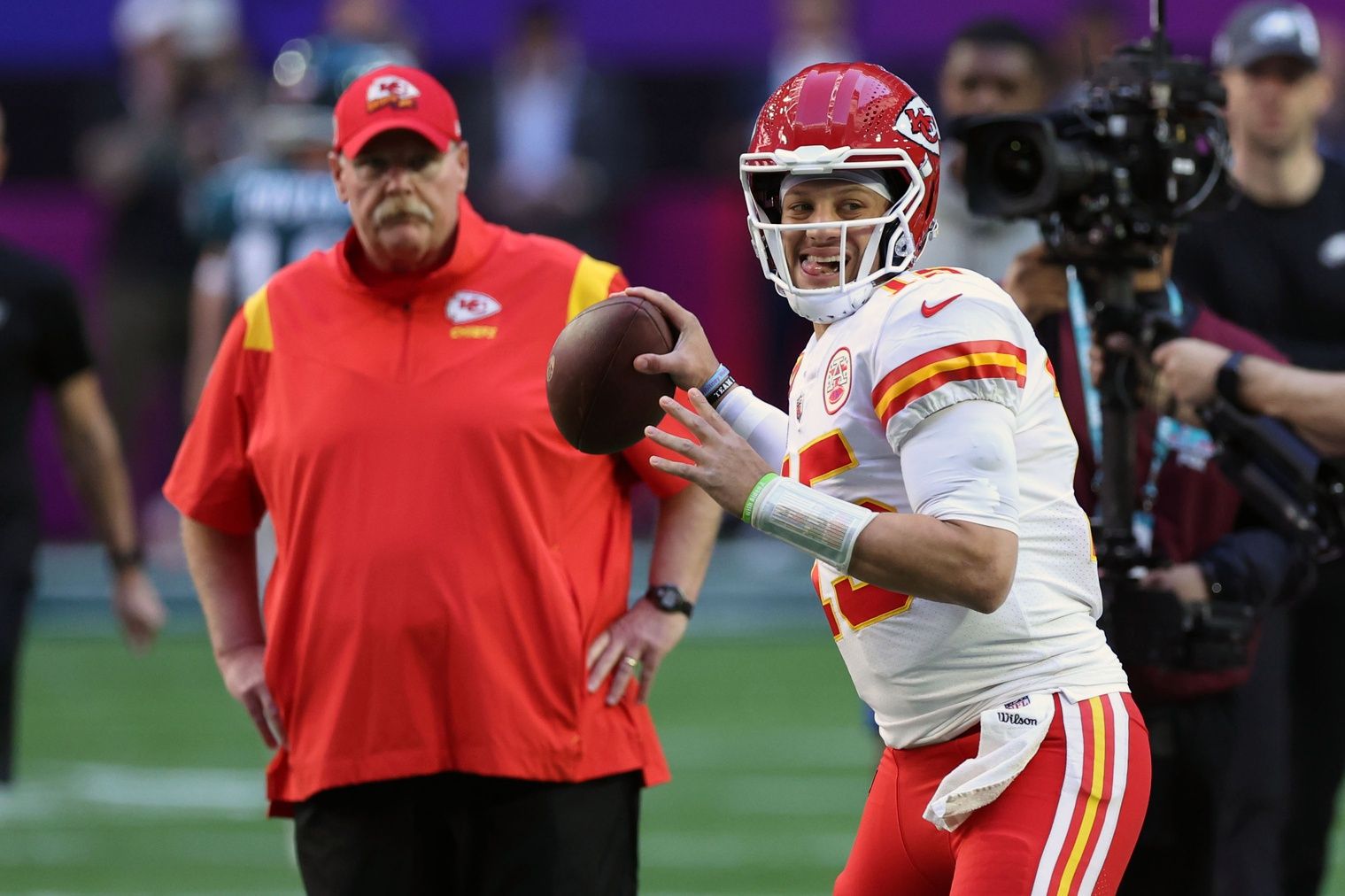 Kansas City Chiefs head coach Andy Reid watches QB Patrick Mahomes (15) during warmups.