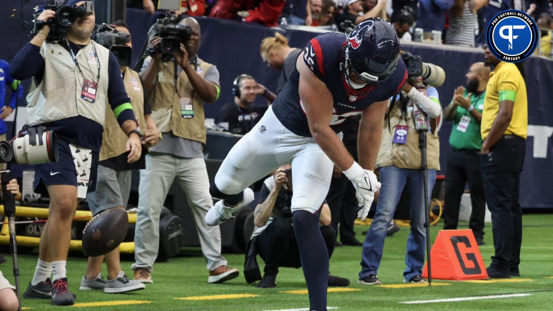 Dalton Schultz (86) spikes the ball after scoring a touchdown against the Tampa Bay Buccaneers in the fourth quarter at NRG Stadium.
