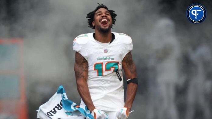 Jaylen Waddle (17) enter the field during pregame ceremonies during an NFL game against the Las Vegas Raiders at Hard Rock Stadium.