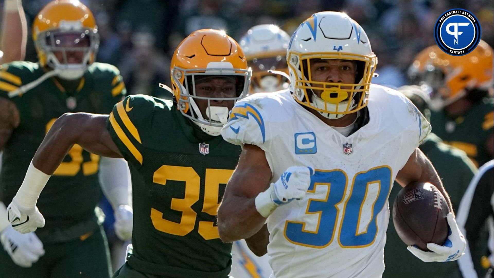 Los Angeles Chargers running back Austin Ekeler (30) picks up 37 yards on a run during the first quarter of their game against the Green Bay Packers Sunday, November 19, 2023 at Lambeau Field in Green Bay, Wisconsin.
