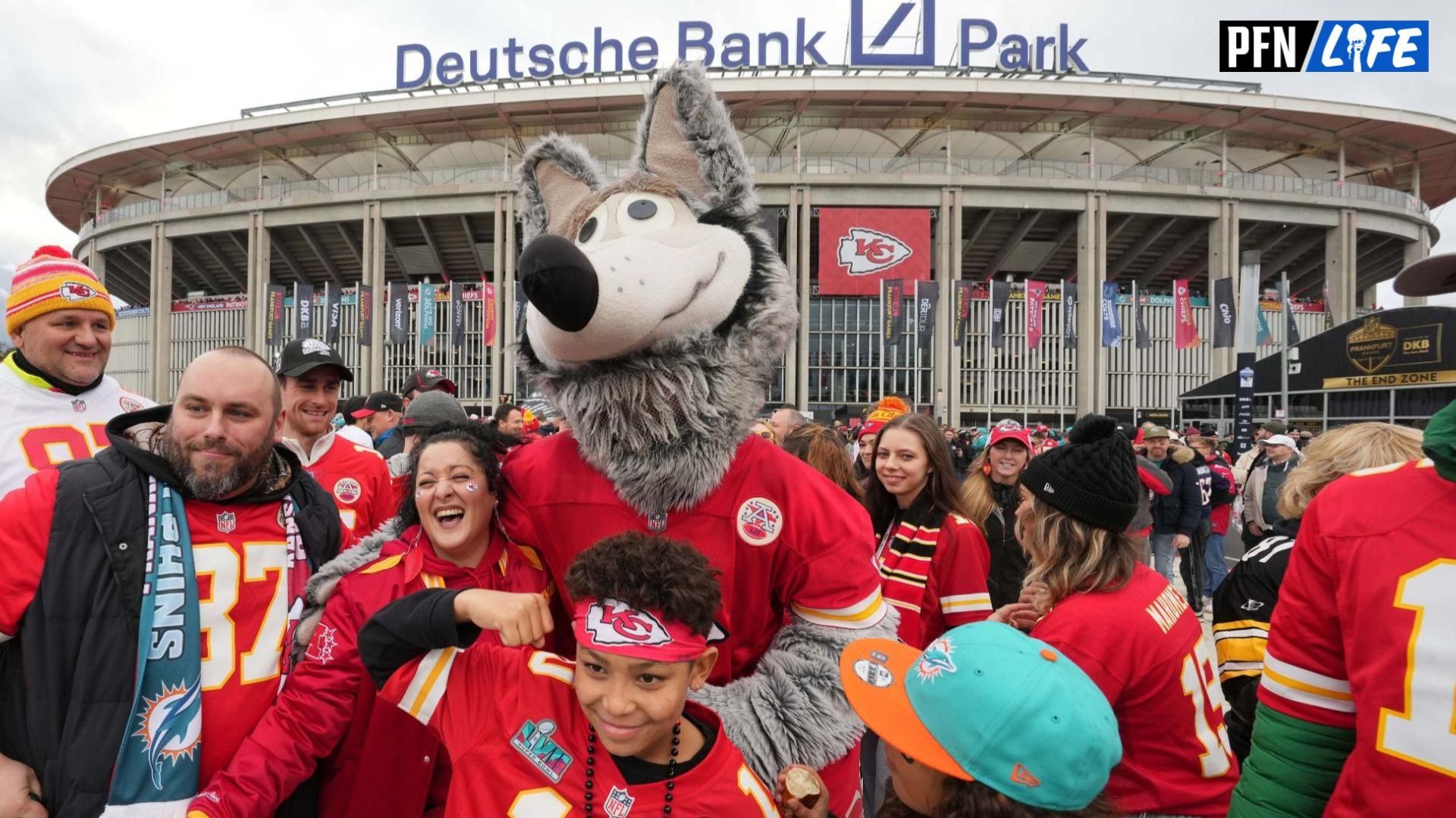 KC Wolf poses with fans during an NFL International Series game at Deutsche Bank Park.