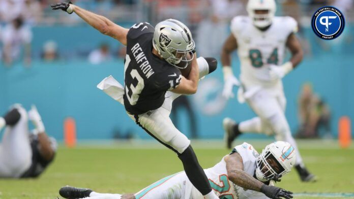 Hunter Renfrow (13) leaps over Miami Dolphins cornerback Xavien Howard (25) during the fourth quarter at Hard Rock Stadium.