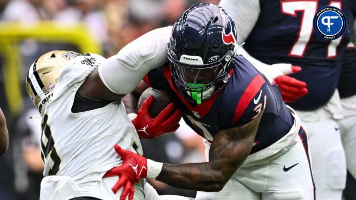 New Orleans Saints defensive tackle Khalen Saunders (99) wraps up Houston Texans running back Dameon Pierce (31) during the first quarter at NRG Stadium.