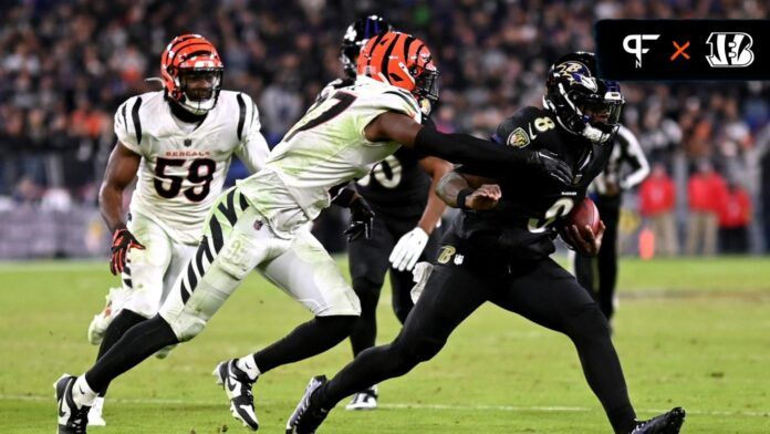 Cincinnati Bengals safety Jordan Battle (27) tackles Baltimore Ravens quarterback Lamar Jackson (8) during the fourth quarter at M&T Bank Stadium.