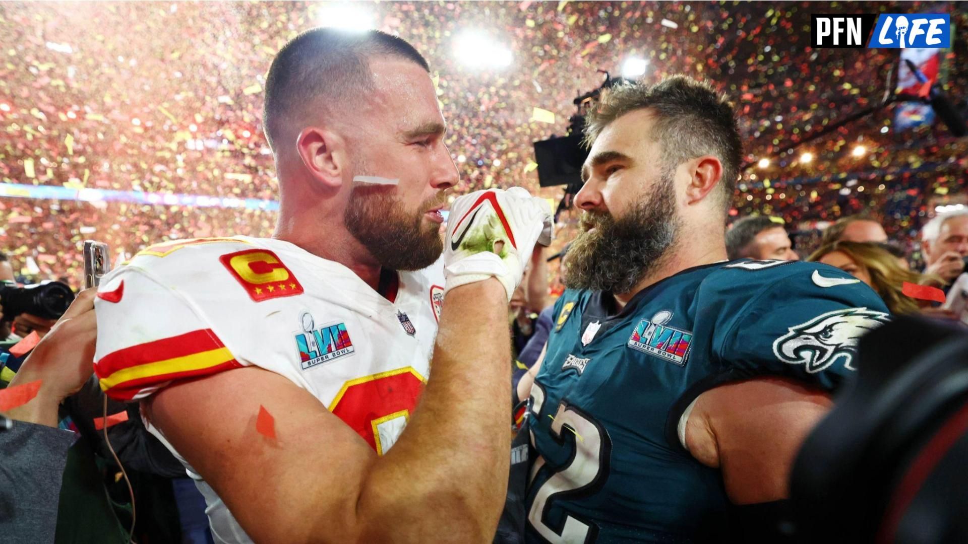 Kansas City Chiefs tight end Travis Kelce (87) talks with his brother Philadelphia Eagles center Jason Kelce (62) after he won Super Bowl LVII.