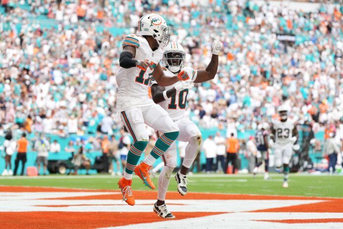 Miami Dolphins wide receiver Jaylen Waddle (17) celebrates his touchdown against the New England Patriots with wide receiver Tyreek Hill (10) during the second half at Hard Rock Stadium.