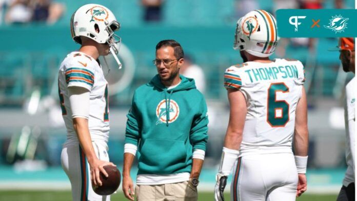 Miami Dolphins head coach Mike McDaniel talks with quarterback Mike White (14) and quarterback Skylar Thompson (6) before a NFL game against the New England Patriots at Hard Rock Stadium in Miami Gardens, Oct. 29, 2023.